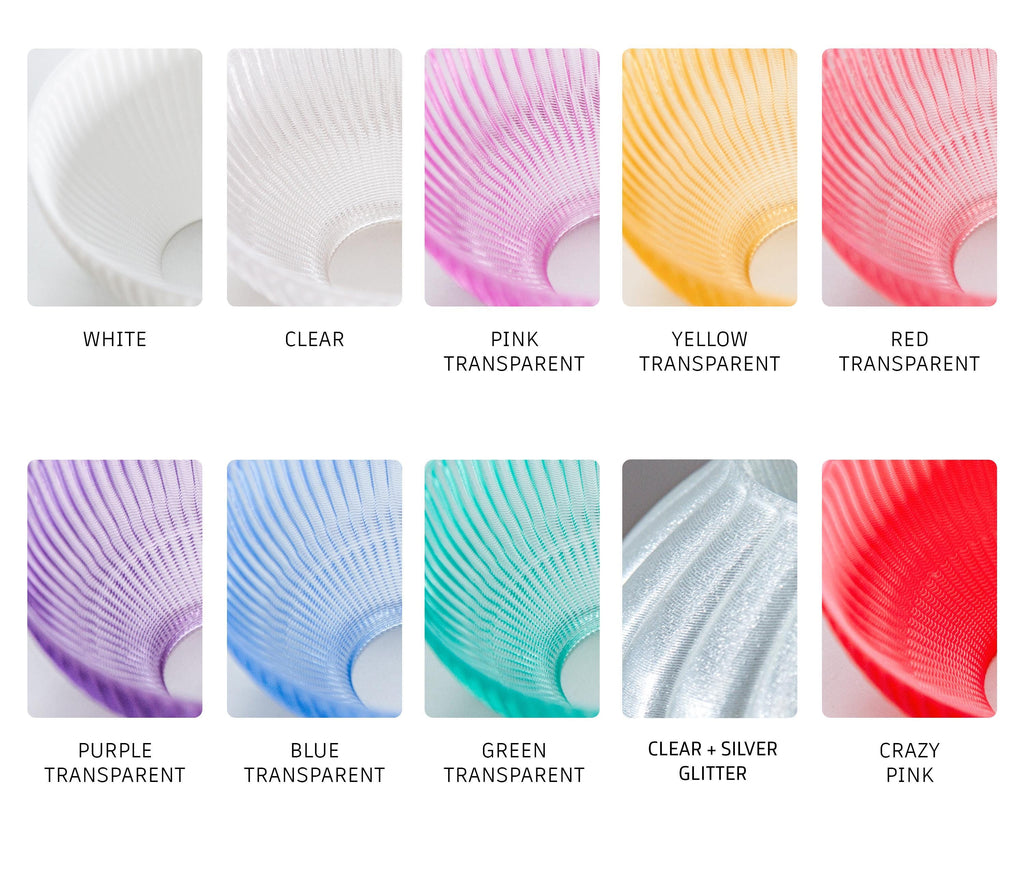 A color-options chart showing multiple translucent ribbed cup or bowl-shaped samples labeled White, Clear, Pink Transparent, Yellow Transparent, Red Transparent, Purple Transparent, Blue Transparent, Green Transparent, Clear + Silver Glitter, and Crazy Pink, arranged in two rows on a white background.